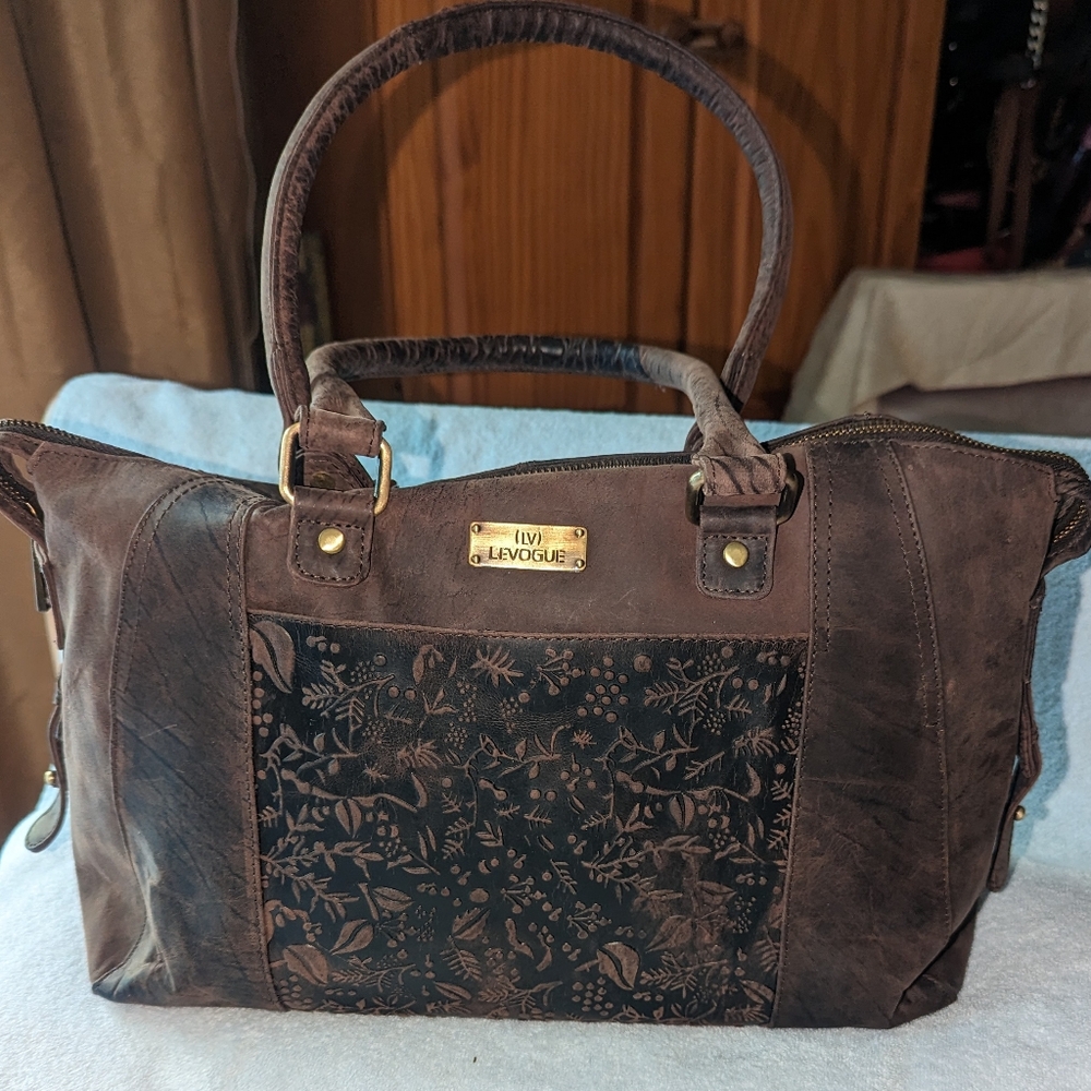 (LV) Levogue flower embossed brown leather bag.